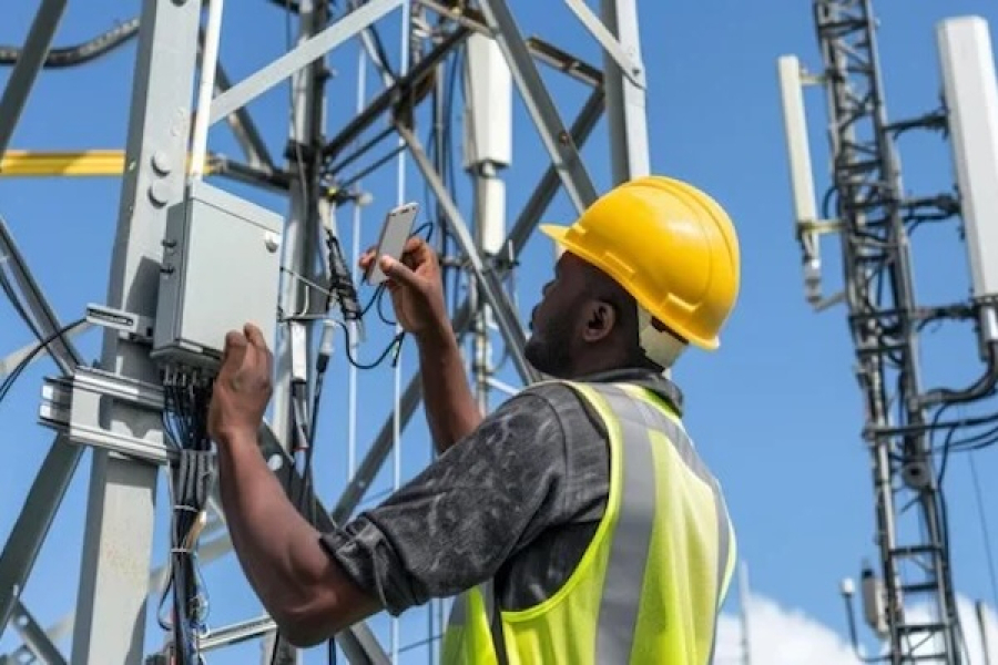 Legazia telecoms technician working on a cellular tower installation